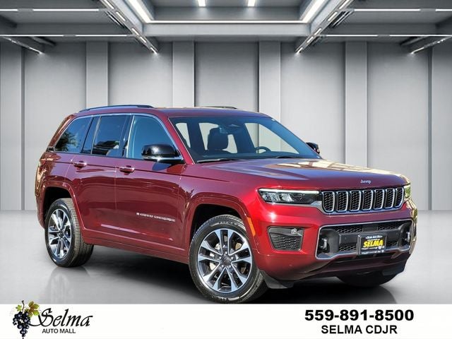 2023 Jeep Grand Cherokee Overland 4x4 in Velvet Red Pearlcoat — front three-quarter view